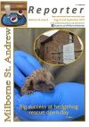 Front cover of the August/September edition showing a rescued hedgehog in gloved hand